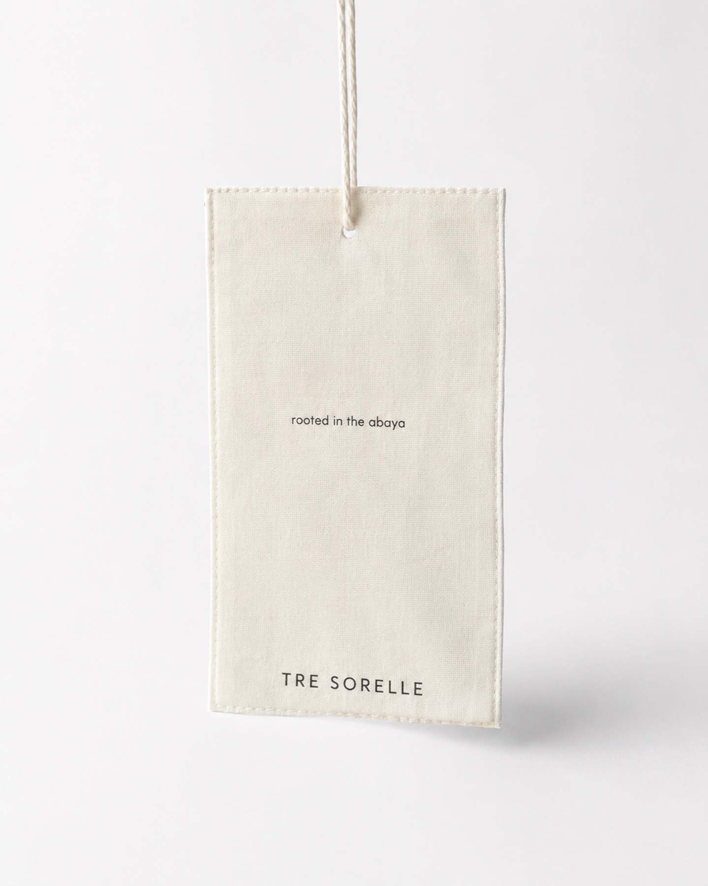 Tre Sorelle hanging garment tag.
