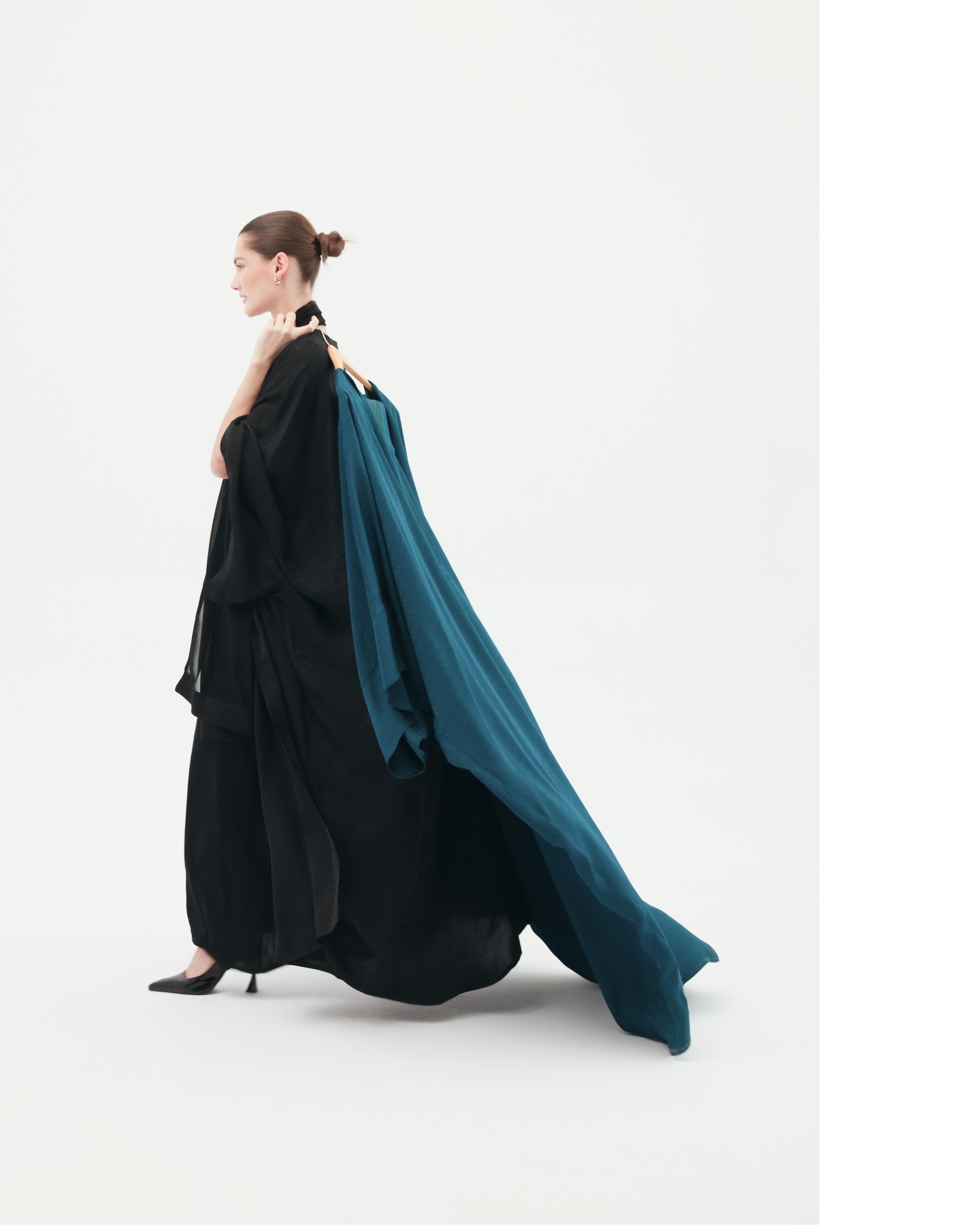 Editorial social post with teal abaya.